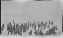Image of Many sealers setting out with poles